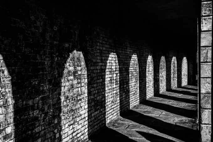 Black and white. Columns shadow cemetery