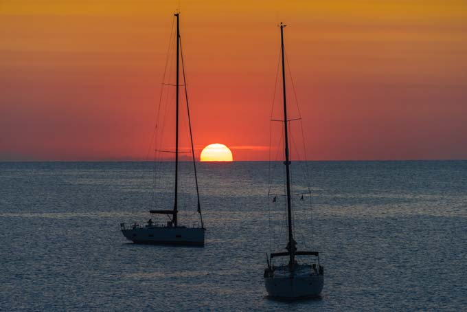 Landscape. Formentera sunset with boats.