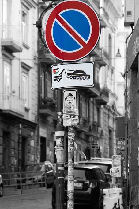 Street photography. No parking no war sign