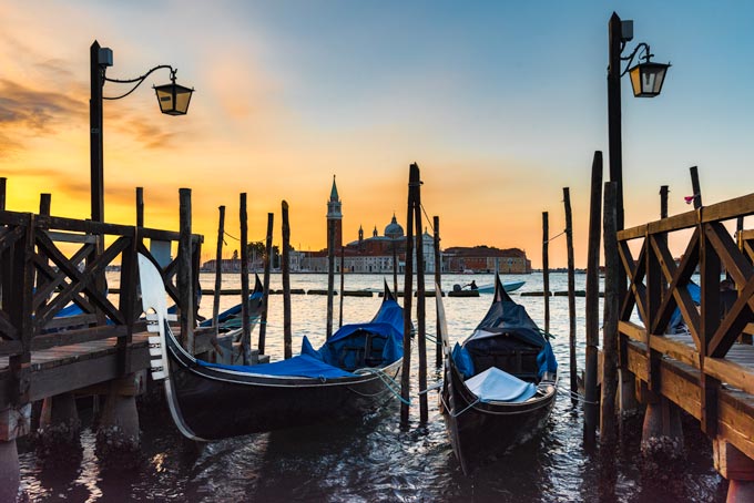Cityscape. Venice sunrise gondolas